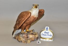 A ROYAL CROWN DERBY EAGLE AND CROWN NAMESTAND, the matt glazed bald eagle modelled perched on a