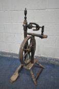 AN ANTIQUE SPINNING WHEEL (condition:-distressed and ideal for restoration)