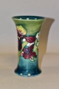 A MOORCROFT POTTERY 'ORCHID' PATTERN VASE, of cylindrical tapering form, tube lined with purple