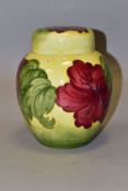A LARGE MOORCROFT POTTERY GINGER JAR AND COVER, 'Hibiscus' pattern on a graduated yellow green