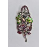 A WHITE METAL PLIQUE A JOUR BROOCH/PENDANT, Art Nouveau style of a lady between flowers, decorated