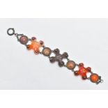 A SCOTTISH AGATE BRACELET, designed with three carved cross banded agates, interspaced with linked
