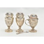 A SILVER THREE PIECE CRUET SET, to include two pepperettes and a mustard, embossed with a floral