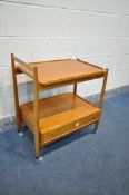 A MID CENTURY WHITE AND NEWTON TEAK TEA TROLLEY, with a loose tray, and a single drawer, length 65cm