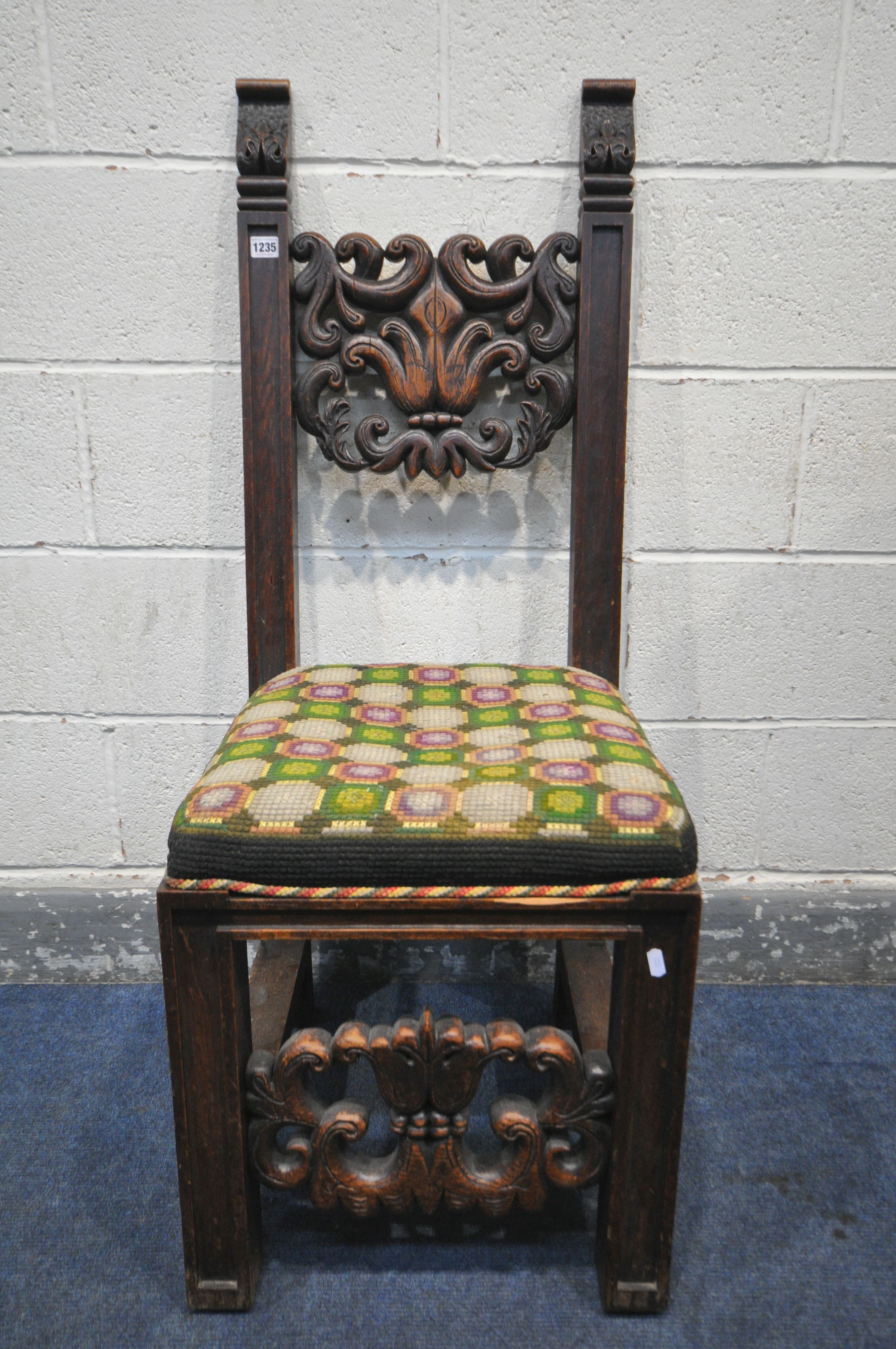 A 19TH CENTURY JACOBEAN STYLE CARVED OAK HALL CHAIR, the twin supports flanking an open foliate back - Image 2 of 5