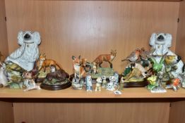 A COLLECTION OF ANIMAL AND BIRD FIGURES, to include a pair of Staffordshire style fireside spaniels,