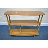 AN ERCOL ELM AND BEECH THREE TIER TROLLEY BOOKCASE, length 91cm x depth 32cm x height 71cm (