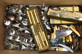 A BOX OF ASSORTED CUTLERY, to include knives, forks, cake slices, fish eaters, sugar tongs, and a