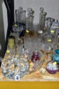 A GROUP OF COLOURED GLASS AND CUT CRYSTAL DECANTERS, comprising a Stuart Crystal 'Cascade' pattern