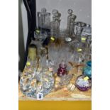 A GROUP OF COLOURED GLASS AND CUT CRYSTAL DECANTERS, comprising a Stuart Crystal 'Cascade' pattern