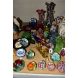 A COLLECTION OF COLOURED AND DECORATIVE GLASSWARES, to include two Mdina paperweights, a Davidson