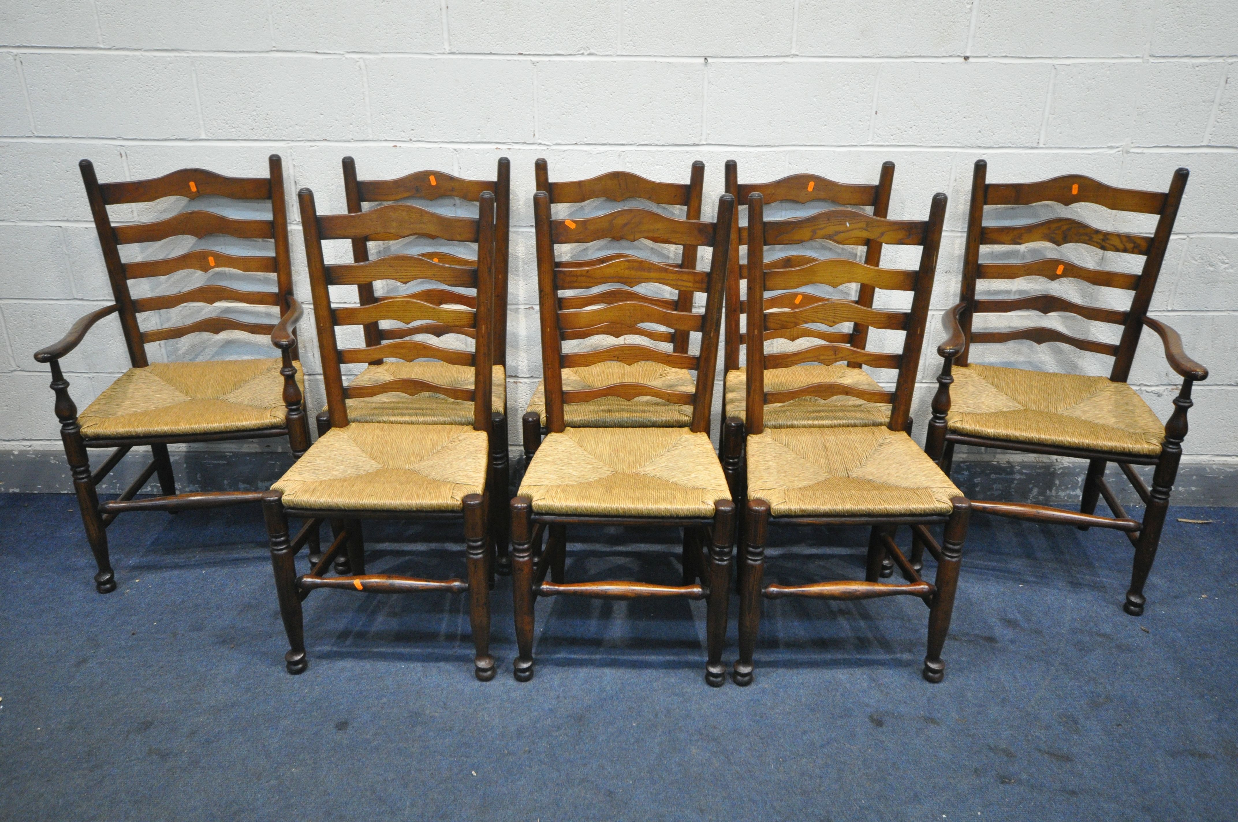 A SET OF EIGHT REPRODUCTION 19TH CENTURY STYLE OAK LANCASHIRE CHAIRS, with ladder backs and loose