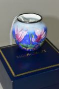 A BOXED MOORCROFT ENAMELS VASE, of small squat form, decorated with cyclamen on a blue ground,