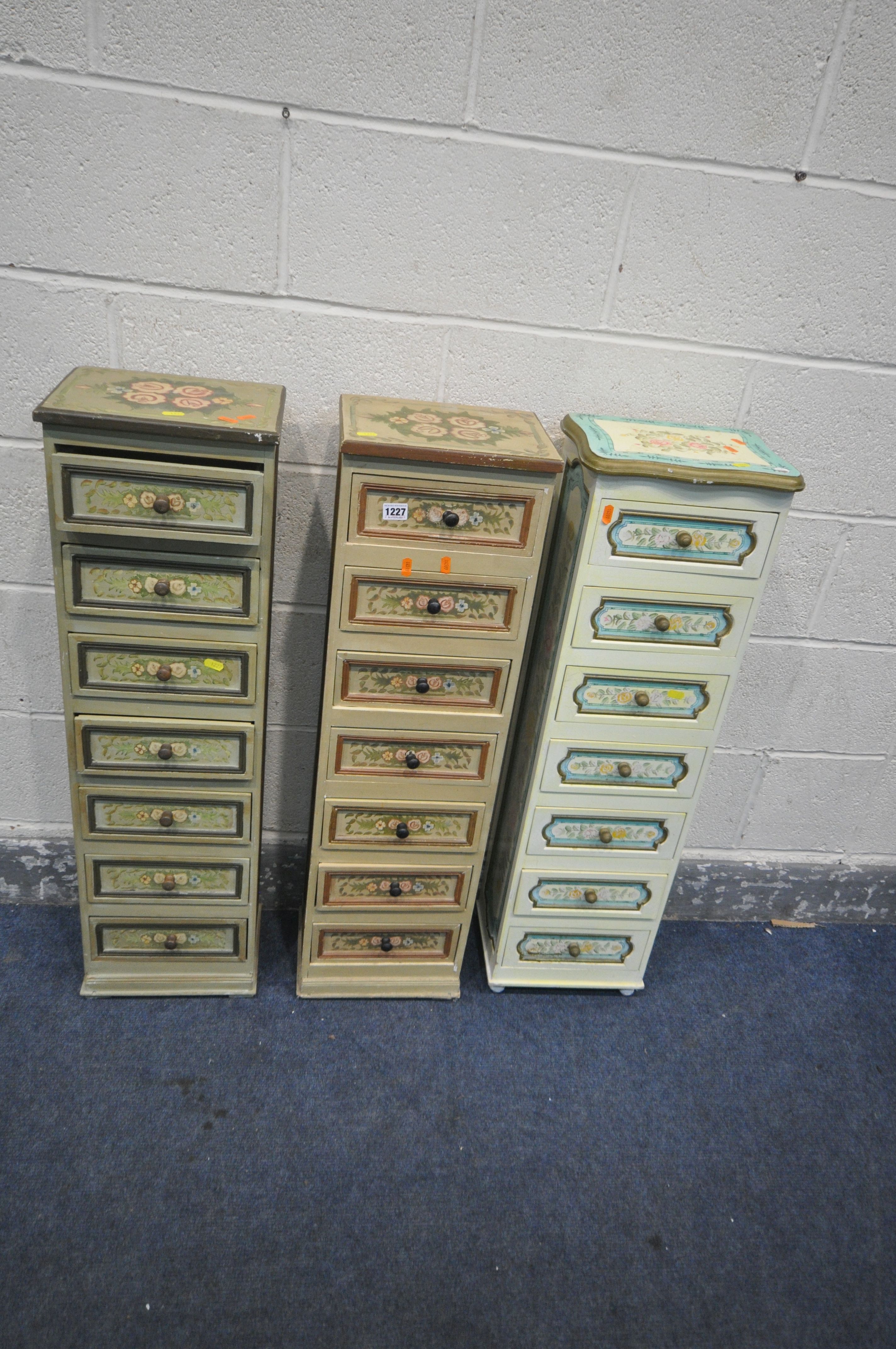 THREE FLORALLY PAINTED TALL SLIM CHEST OF SEVEN DRAWERS, width 28cm x depth 22cm x height 97cm (