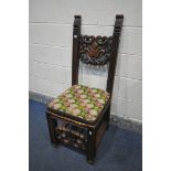 A 19TH CENTURY JACOBEAN STYLE CARVED OAK HALL CHAIR, the twin supports flanking an open foliate back