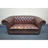 AN OXBLOOD LEATHER CHESTERFIELD SOFA, length 167cm (condition:-leather worn to high wear area's no
