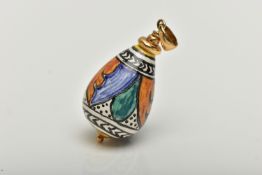 A YELLOW METAL AND CERAMIC PENDANT, polychrome ceramic tear drop pendant detailed with green,