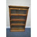 A 20TH CENTURY OAK GUMM SECTIONAL BOOKCASE, the four sections with hide and fall glass doors,