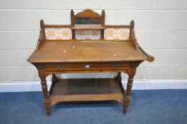 AN EDWARDIAN PINE WASHSTAND, with a raised back, with a small mirror and tiles, a single drawer