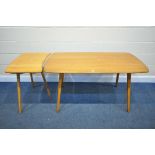 AN ERCOL ELM AND BEECH DINING TABLE. with a model 265 extension table, length of table 138cm x depth