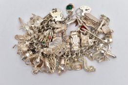 A WHITE METAL CHARM BRACELET AND CHARMS, a double curb link bracelet, fitted with a heart padlock