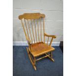 A BEECH SPINDLE BACK ROCKING CHAIR