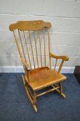 A BEECH SPINDLE BACK ROCKING CHAIR