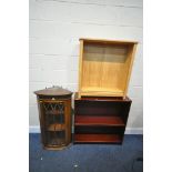 A MAHOGANY SINGLE DOOR HANGING CORNER CUPBOARD (one key) and two open bookcases (condition:-