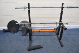 A MIRAFIT ADJUSTABLE SQUAT/BENCH RACK, along with an Olympic weight bar, another weight bar, two