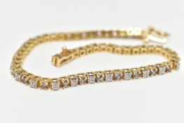 A YELLOW METAL AND GEMSET BRACELET, a yellow metal line bracelet set with thirty round brilliant cut
