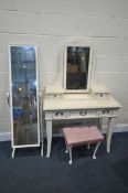 A CREAM DRESSING TABLE with a swing mirror, with five drawers, width 96cm x depth 47cm x height