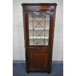 A GEORGIAN MAHOGANY AND INLAID CORNER CUPBOARD, the top section with a single astragal glazed door