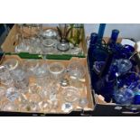 THREE BOXES OF GLASSWARES, to include a box of blue glass containing bottles, vases tallest 50.