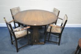 AN OAK DROP LEAF TRESTLE DINING TABLE, open diameter 122cm x closed width 61cm x height 74cm, and
