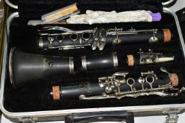 A CASED CLARINET AND MUSIC STAND, the clarinet is a Prelude by Conn Selmer, in original fitted