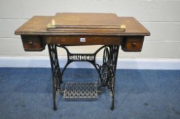A VINTAGE SINGER TREADLE SEWING MACHINE (condition:-worn finish)