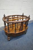 A VICTORIAN WALNUT CANTERBURY, with three divisions, turned and open fretwork spindles, single