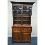 A GEORGIAN MAHOGANY SECRETAIRE BOOKCASE, with an overhanging cornice, the two astragal glazed