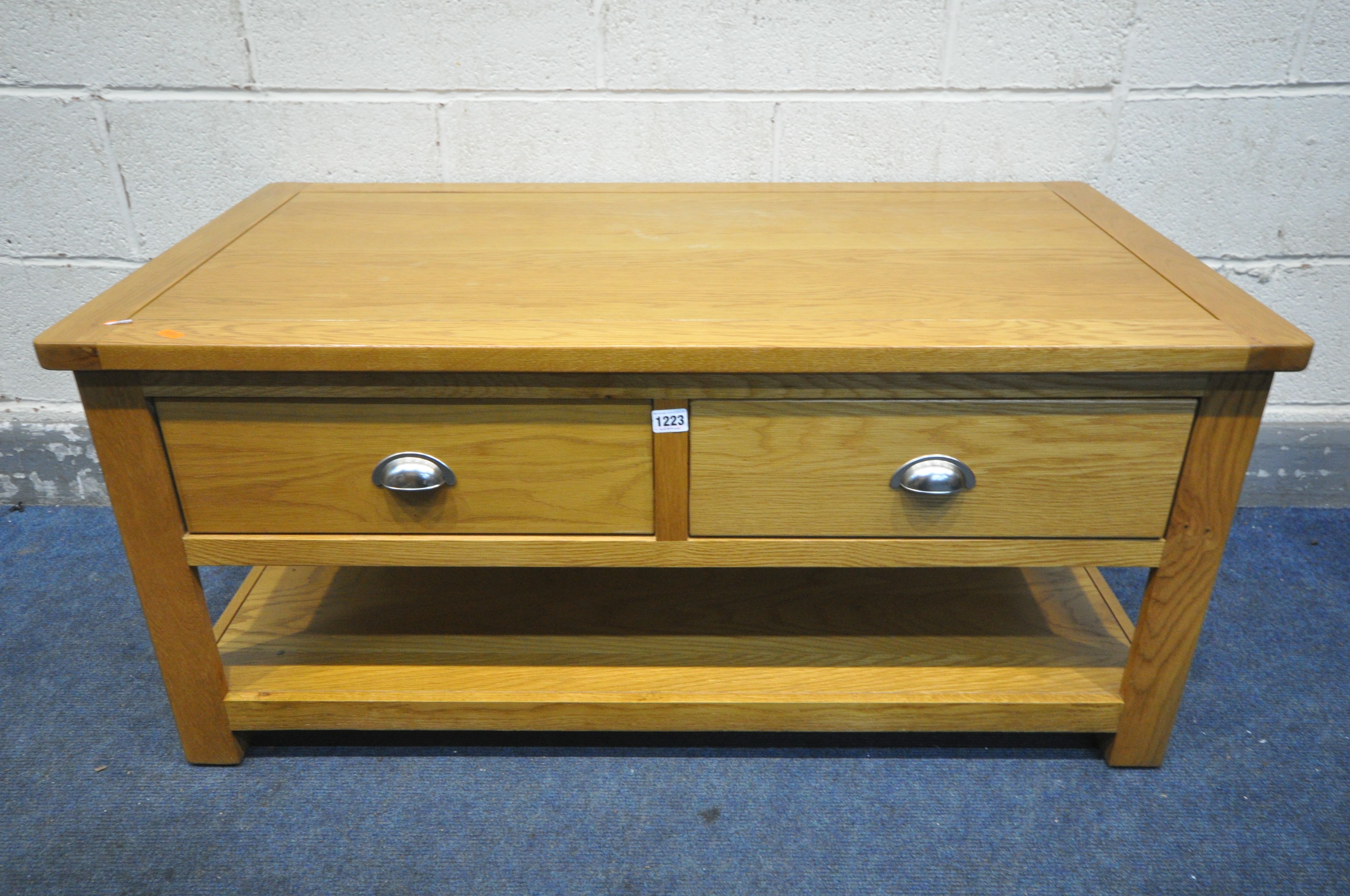 AN OAK COFFEE TABLE, with two drawers, and undershelf, length 110cm x depth 60cm x height 50cm (