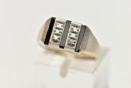 A WHITE METAL SIGNET RING, two rows of three round brilliant cut diamonds grain set with three