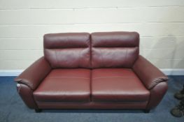 A BURGUNDY LEATHERETTE TWO SEATER SOFA, length 180cm (condition - some pet scratches)