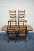 A WEBBER FURNITURE CO OAK EXTENDING DINING TABLE, with a single additional leaf, on twin acorn