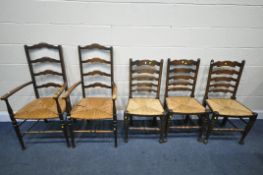 A PAIR OF 20TH CENTURY BEECH ELBOW CHAIRS, with rush seats, along with three ladder back chairs (5)