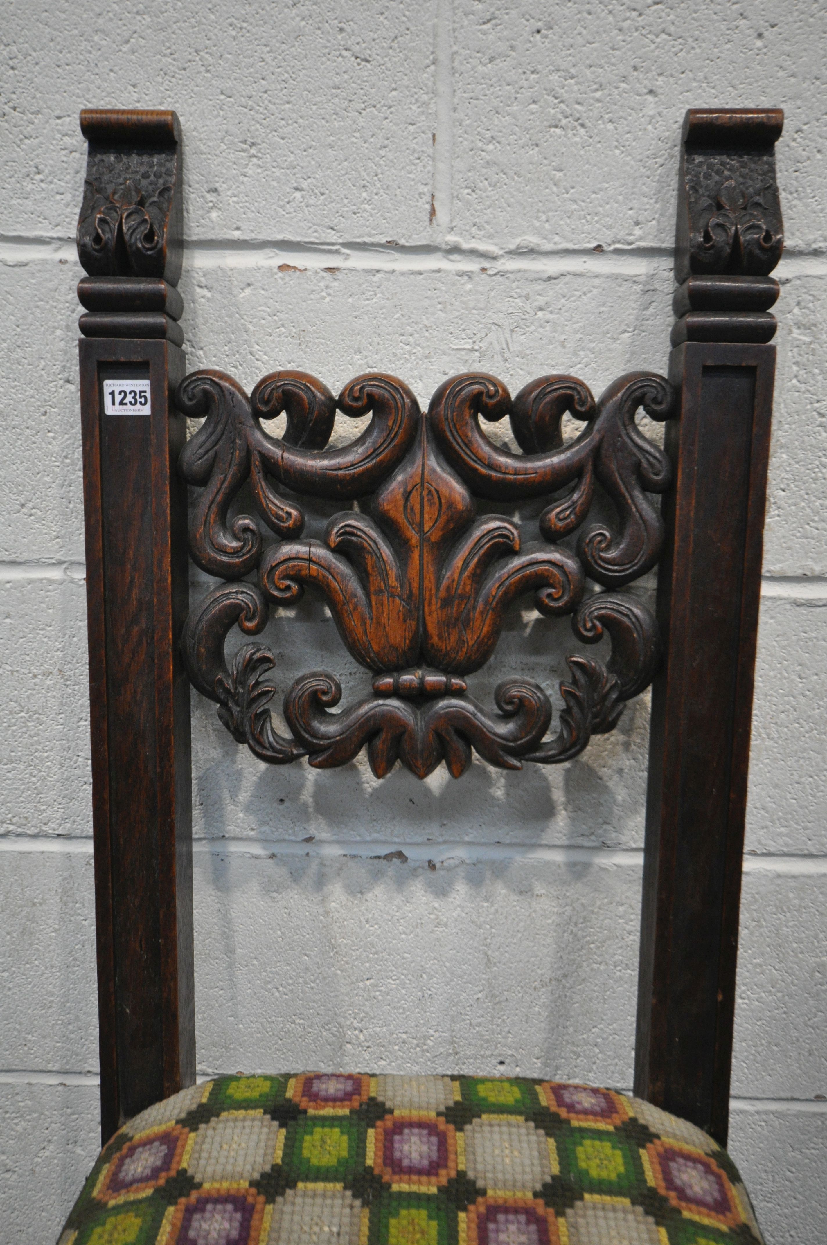 A 19TH CENTURY JACOBEAN STYLE CARVED OAK HALL CHAIR, the twin supports flanking an open foliate back - Image 3 of 5