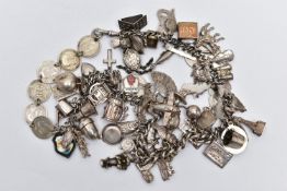 A SILVER ALBERT CHAIN WITH CHARMS AND COINS, graduated albert chain, each link stamped with a
