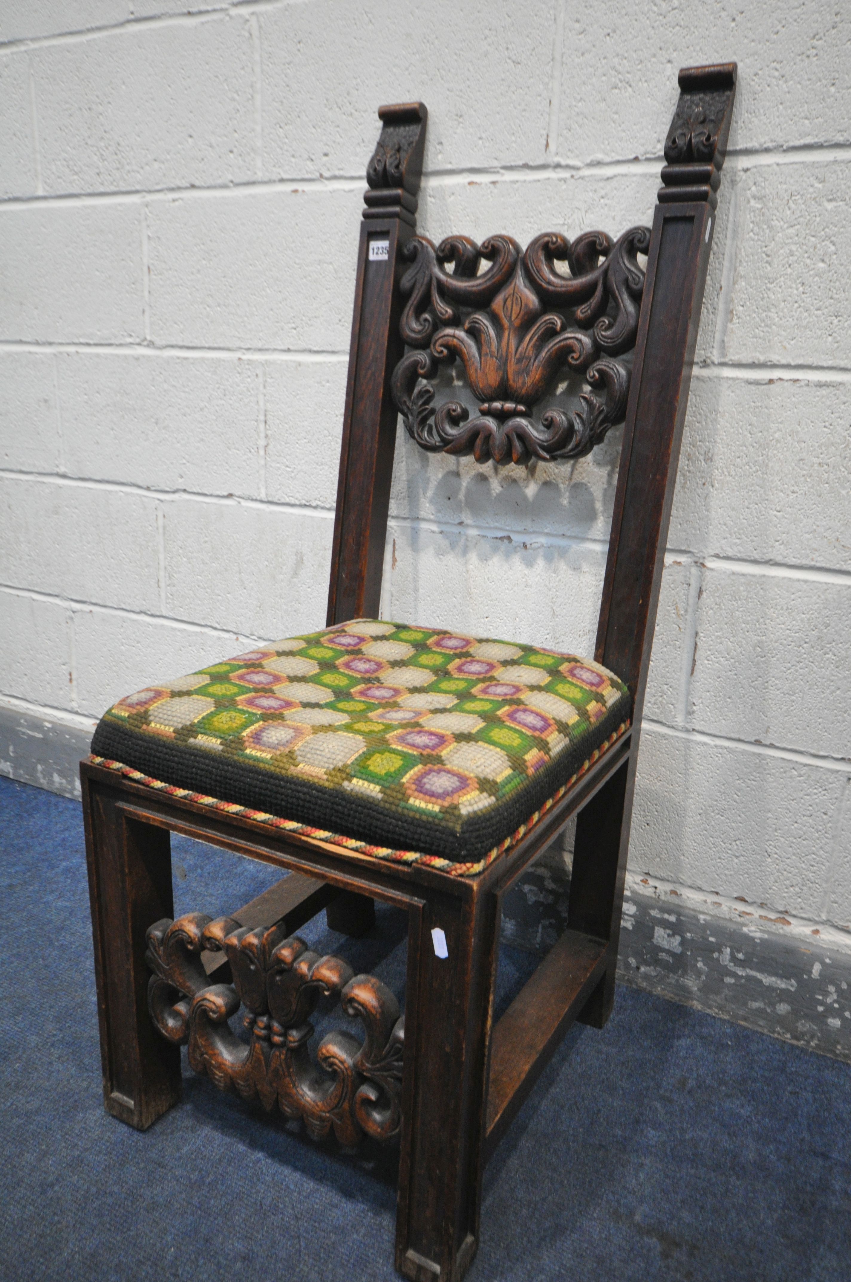 A 19TH CENTURY JACOBEAN STYLE CARVED OAK HALL CHAIR, the twin supports flanking an open foliate back - Image 5 of 5