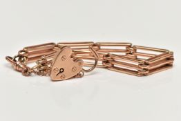 A ROSE METAL GATE BRACELET, a three bar gate bracelet, fitted with a swivel lobster clasp fitted