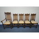 A SET OF FIVE EARLY 20TH CENTURY OAK DINING CHAIRS, including one carver, with foliate detail to