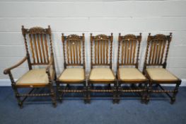 A SET OF FIVE EARLY 20TH CENTURY OAK DINING CHAIRS, including one carver, with foliate detail to