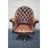 A BUTTONED OXBLOOD LEATHER DIRECTORS DESK CHAIR, on five legs, width 87cm x depth 73cm x height